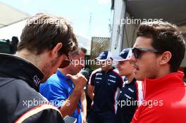 (L to R): Romain Grosjean (FRA) Lotus F1 Team with Jules Bianchi (FRA) Marussia F1 Team on the drivers parade. 09.06.2013. Formula 1 World Championship, Rd 7, Canadian Grand Prix, Montreal, Canada, Race Day.