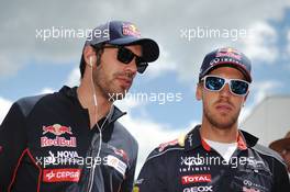 (L to R): Jean-Eric Vergne (FRA) Scuderia Toro Rosso with Sebastian Vettel (GER) Red Bull Racing on the drivers parade. 09.06.2013. Formula 1 World Championship, Rd 7, Canadian Grand Prix, Montreal, Canada, Race Day.