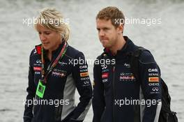 Sebastian Vettel (GER) Red Bull Racing with Britta Roeske (AUT) Red Bull Racing Press Officer. 06.06.2013. Formula 1 World Championship, Rd 7, Canadian Grand Prix, Montreal, Canada, Preparation Day.