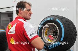 Ferrari mechanic with Pirelli tyres. 06.06.2013. Formula 1 World Championship, Rd 7, Canadian Grand Prix, Montreal, Canada, Preparation Day.