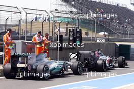 Esteban Gutierrez (MEX) Sauber C32 and Lewis Hamilton (GBR) Mercedes AMG F1 W04. 12.04.2013. Formula 1 World Championship, Rd 3, Chinese Grand Prix, Shanghai, China, Practice Day.