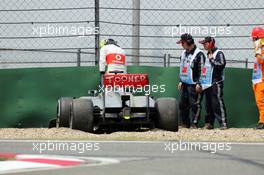 Sergio Perez (MEX) McLaren MP4-28 crashed at the pit entrance at the end of the first practice session. 12.04.2013. Formula 1 World Championship, Rd 3, Chinese Grand Prix, Shanghai, China, Practice Day.