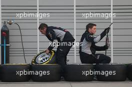 Red Bull Racing mechanics with Pirelli tyres. 12.04.2013. Formula 1 World Championship, Rd 3, Chinese Grand Prix, Shanghai, China, Practice Day.