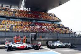 Lewis Hamilton (GBR) Mercedes AMG F1 W04 and Sergio Perez (MEX) McLaren MP4-28. 12.04.2013. Formula 1 World Championship, Rd 3, Chinese Grand Prix, Shanghai, China, Practice Day.