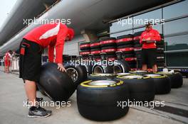 Marussia F1 Team mechanics with Pirelli tyres. 12.04.2013. Formula 1 World Championship, Rd 3, Chinese Grand Prix, Shanghai, China, Practice Day.