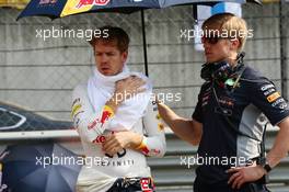 Sebastian Vettel (GER) Red Bull Racing with Heikki Huovinen (FIN) Personal Trainer on the grid. 14.04.2013. Formula 1 World Championship, Rd 3, Chinese Grand Prix, Shanghai, China, Race Day.