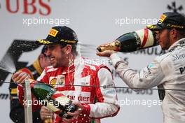 Race winner Fernando Alonso (ESP) Ferrari celebrates on the podium with third placed Lewis Hamilton (GBR) Mercedes AMG F1. 14.04.2013. Formula 1 World Championship, Rd 3, Chinese Grand Prix, Shanghai, China, Race Day.