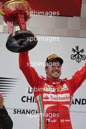 Race winner Fernando Alonso (ESP) Ferrari celebrates on the podium. 14.04.2013. Formula 1 World Championship, Rd 3, Chinese Grand Prix, Shanghai, China, Race Day.