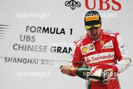 Race winner Fernando Alonso (ESP) Ferrari celebrates on the podium. 14.04.2013. Formula 1 World Championship, Rd 3, Chinese Grand Prix, Shanghai, China, Race Day.