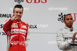 Race winner Fernando Alonso (ESP) Ferrari celebrates on the podium with third placed Lewis Hamilton (GBR) Mercedes AMG F1. 14.04.2013. Formula 1 World Championship, Rd 3, Chinese Grand Prix, Shanghai, China, Race Day.