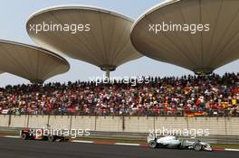 Lewis Hamilton (GBR) Mercedes AMG F1 W04 leads Kimi Raikkonen (FIN) Lotus F1 E21. 14.04.2013. Formula 1 World Championship, Rd 3, Chinese Grand Prix, Shanghai, China, Race Day.