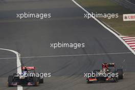 Daniel Ricciardo (AUS) Scuderia Toro Rosso STR8 and Kimi Raikkonen (FIN) Lotus F1 E21 battle for position. 14.04.2013. Formula 1 World Championship, Rd 3, Chinese Grand Prix, Shanghai, China, Race Day.