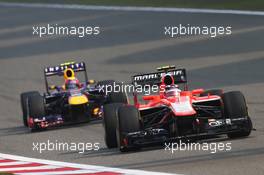 Jules Bianchi (FRA) Marussia F1 Team MR02 leads Mark Webber (AUS) Red Bull Racing RB9. 14.04.2013. Formula 1 World Championship, Rd 3, Chinese Grand Prix, Shanghai, China, Race Day.