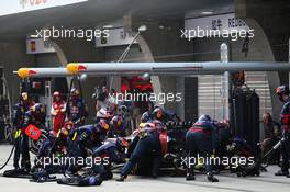 Sebastian Vettel (GER) Red Bull Racing RB9 makes a pit stop. 14.04.2013. Formula 1 World Championship, Rd 3, Chinese Grand Prix, Shanghai, China, Race Day.