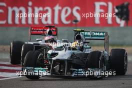 Lewis Hamilton (GBR) Mercedes AMG F1 W04 leads Jenson Button (GBR) McLaren MP4-28. 14.04.2013. Formula 1 World Championship, Rd 3, Chinese Grand Prix, Shanghai, China, Race Day.