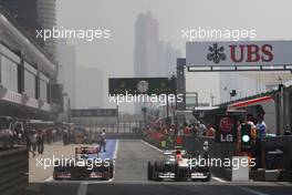 (L to R): Daniel Ricciardo (AUS) Scuderia Toro Rosso STR8 and Adrian Sutil (GER) Sahara Force India VJM06 leave the pits. 13.04.2013. Formula 1 World Championship, Rd 3, Chinese Grand Prix, Shanghai, China, Qualifying Day.