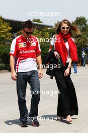 Fernando Alonso (ESP) Ferrari with his girlfriend Dasha Kapustina (RUS). 13.04.2013. Formula 1 World Championship, Rd 3, Chinese Grand Prix, Shanghai, China, Qualifying Day.