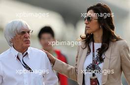 Bernie Ecclestone (GBR) CEO Formula One Group (FOM) with wife Fabiana Flosi (BRA) 13.04.2013. Formula 1 World Championship, Rd 3, Chinese Grand Prix, Shanghai, China, Qualifying Day.