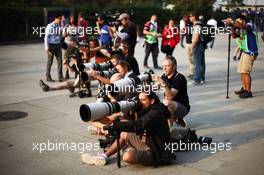 Photographers shooting in the paddock. 13.04.2013. Formula 1 World Championship, Rd 3, Chinese Grand Prix, Shanghai, China, Qualifying Day.