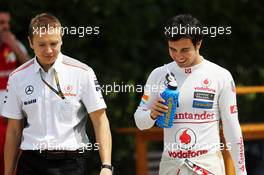 Sergio Perez (MEX) McLaren with Antti Vierula (FIN) Personal Trainer. 13.04.2013. Formula 1 World Championship, Rd 3, Chinese Grand Prix, Shanghai, China, Qualifying Day.