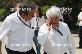 (L to R): Pasquale Lattuneddu (ITA) of the FOM with Bernie Ecclestone (GBR) CEO Formula One Group (FOM). 14.04.2013. Formula 1 World Championship, Rd 3, Chinese Grand Prix, Shanghai, China, Race Day.