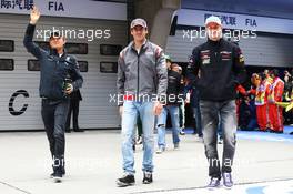 (L to R): Nico Rosberg (GER) Mercedes AMG F1 with Adrian Sutil (GER) Sauber and Nico Hulkenberg (GER) Sahara Force India F1 on the drivers parade. 20.04.2014. Formula 1 World Championship, Rd 4, Chinese Grand Prix, Shanghai, China, Race Day.