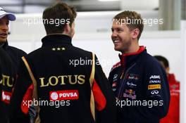 (L to R): Romain Grosjean (FRA) Lotus F1 Team with Sebastian Vettel (GER) Red Bull Racing on the drivers parade. 20.04.2014. Formula 1 World Championship, Rd 4, Chinese Grand Prix, Shanghai, China, Race Day.