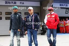 (L to R): Lewis Hamilton (GBR) Mercedes AMG F1 with Valtteri Bottas (FIN) Williams and Fernando Alonso (ESP) Ferrari on the drivers parade. 20.04.2014. Formula 1 World Championship, Rd 4, Chinese Grand Prix, Shanghai, China, Race Day.