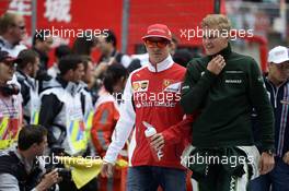 (L to R): Kimi Raikkonen (FIN) Ferrari with Marcus Ericsson (SWE) Caterham on the drivers parade. 20.04.2014. Formula 1 World Championship, Rd 4, Chinese Grand Prix, Shanghai, China, Race Day.