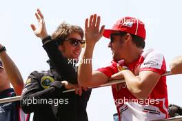 (L to R): Romain Grosjean (FRA) Lotus F1 Team and Fernando Alonso (ESP) Ferrari on the drivers parade. 14.04.2013. Formula 1 World Championship, Rd 3, Chinese Grand Prix, Shanghai, China, Race Day.