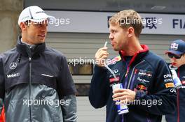 (L to R): Jenson Button (GBR) McLaren with Sebastian Vettel (GER) Red Bull Racing on the drivers parade. 20.04.2014. Formula 1 World Championship, Rd 4, Chinese Grand Prix, Shanghai, China, Race Day.