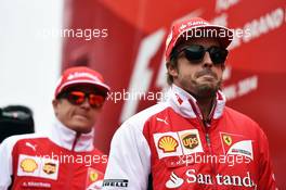 Fernando Alonso (ESP) Ferrari and Kimi Raikkonen (FIN) Ferrari on the drivers parade. 20.04.2014. Formula 1 World Championship, Rd 4, Chinese Grand Prix, Shanghai, China, Race Day.
