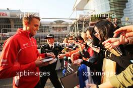 Max Chilton (GBR) Marussia F1 Team signs autographs for the fans. 11.04.2013. Formula 1 World Championship, Rd 3, Chinese Grand Prix, Shanghai, China, Preparation Day.
