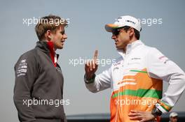(L to R): Nico Hulkenberg (GER) Sauber with Adrian Sutil (GER) Sahara Force India F1. 11.04.2013. Formula 1 World Championship, Rd 3, Chinese Grand Prix, Shanghai, China, Preparation Day.