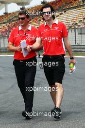(L to R): Graeme Lowdon (GBR) Marussia F1 Team Chief Executive Officer and Marc Hynes (GBR) Marussia F1 Team Driver Coach walk the circuit. 11.04.2013. Formula 1 World Championship, Rd 3, Chinese Grand Prix, Shanghai, China, Preparation Day.