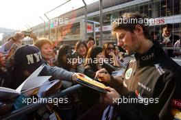 Romain Grosjean (FRA) Lotus F1 Team signs autographs for the fans. 11.04.2013. Formula 1 World Championship, Rd 3, Chinese Grand Prix, Shanghai, China, Preparation Day.