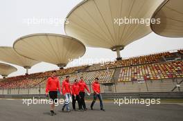Rodolfo Gonzalez (VEN) Marussia F1 Team Reserve Driver and Jules Bianchi (FRA) Marussia F1 Team walk the circuit. 11.04.2013. Formula 1 World Championship, Rd 3, Chinese Grand Prix, Shanghai, China, Preparation Day.
