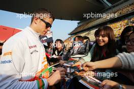 Paul di Resta (GBR) Sahara Force India F1 signs autographs for the fans. 11.04.2013. Formula 1 World Championship, Rd 3, Chinese Grand Prix, Shanghai, China, Preparation Day.