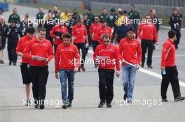 Jules Bianchi (FRA) Marussia F1 Team and Rodolfo Gonzalez (VEN) Marussia F1 Team Reserve Driver walk the circuit. 11.04.2013. Formula 1 World Championship, Rd 3, Chinese Grand Prix, Shanghai, China, Preparation Day.