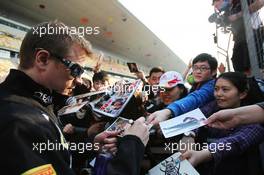 Kimi Raikkonen (FIN) Lotus F1 Team signs autographs for the fans. 11.04.2013. Formula 1 World Championship, Rd 3, Chinese Grand Prix, Shanghai, China, Preparation Day.