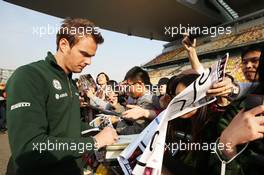Giedo van der Garde (NLD) Caterham F1 Team signs autographs for the fans. 11.04.2013. Formula 1 World Championship, Rd 3, Chinese Grand Prix, Shanghai, China, Preparation Day.