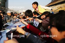 Nico Rosberg (GER) Mercedes AMG F1 signs autographs for the fans. 11.04.2013. Formula 1 World Championship, Rd 3, Chinese Grand Prix, Shanghai, China, Preparation Day.