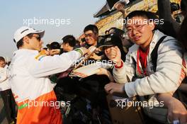 Adrian Sutil (GER) Sahara Force India F1 signs autographs for the fans. 11.04.2013. Formula 1 World Championship, Rd 3, Chinese Grand Prix, Shanghai, China, Preparation Day.