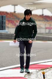 Ma Qing Hua (CHN) Caterham F1 Reserve Driver walks the circuit. 11.04.2013. Formula 1 World Championship, Rd 3, Chinese Grand Prix, Shanghai, China, Preparation Day.