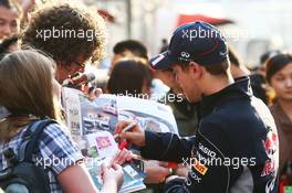 Sebastian Vettel (GER) Red Bull Racing signs autographs for the fans. 11.04.2013. Formula 1 World Championship, Rd 3, Chinese Grand Prix, Shanghai, China, Preparation Day.