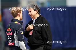 (L to R): Sebastian Vettel (GER) Red Bull Racing with Pasquale Lattuneddu (ITA) of the FOM. 11.04.2013. Formula 1 World Championship, Rd 3, Chinese Grand Prix, Shanghai, China, Preparation Day.