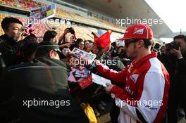 Fernando Alonso (ESP) Ferrari signs autographs for the fans. 11.04.2013. Formula 1 World Championship, Rd 3, Chinese Grand Prix, Shanghai, China, Preparation Day.
