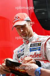 Jenson Button (GBR) McLaren signs autographs for the fans. 10.05.2013. Formula 1 World Championship, Rd 5, Spanish Grand Prix, Barcelona, Spain, Practice Day