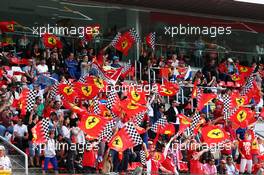 Ferrari fans wave their flags. 11.05.2013. Formula 1 World Championship, Rd 5, Spanish Grand Prix, Barcelona, Spain, Qualifying Day