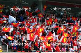 Ferrari fans wave their flags. 11.05.2013. Formula 1 World Championship, Rd 5, Spanish Grand Prix, Barcelona, Spain, Qualifying Day